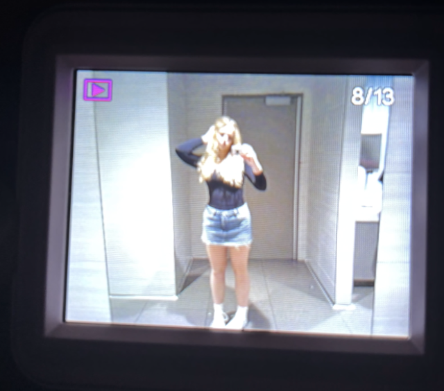 Taylor wears a denim skirt and black top in Kansas City. 